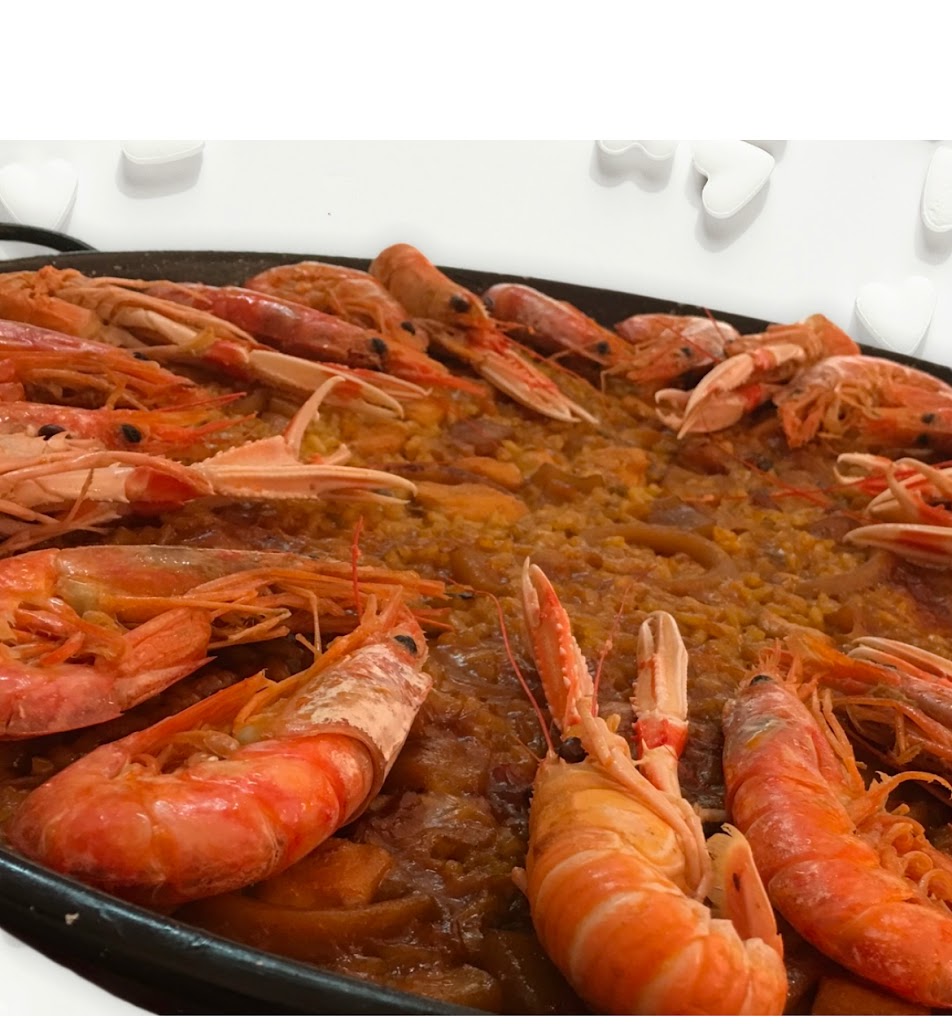Pollos a l'ast Cuinats Maribel — Paella
