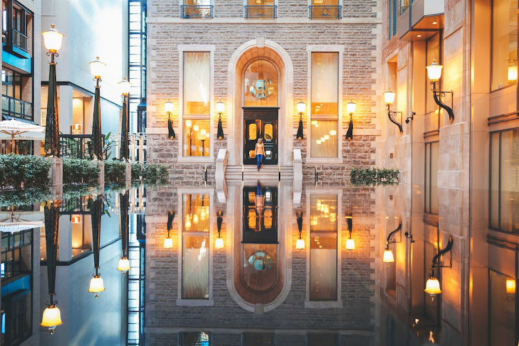 A glass-like reflection outside InterContinental Hotel Montreal in Old Montreal.