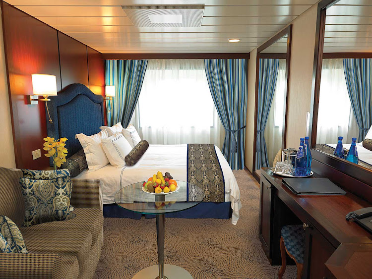 The C Level Deluxe Ocean View staterooms on Oceania Nautica contain custom-designed furnishings, queen or two twin bed accommodations, spacious seating area, vanity desk and breakfast table. At 165 square feet, they're located on decks 4,6 and 7.   