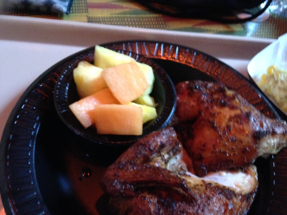 Gluten free chicken, fruit, corn on the Cobb, and salad at Zambia smokehouse