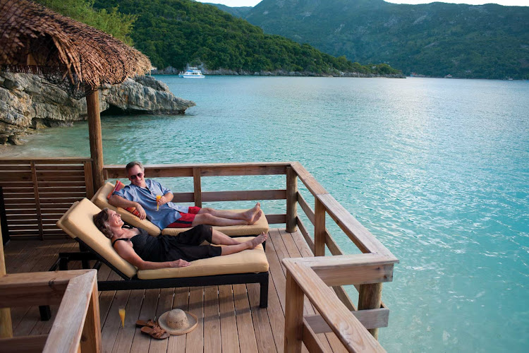Getaways done right: A couple watches the water action from a cabana in Labadee, Royal Caribbean's 260-acre private beach resort on the north shore of Haiti. 