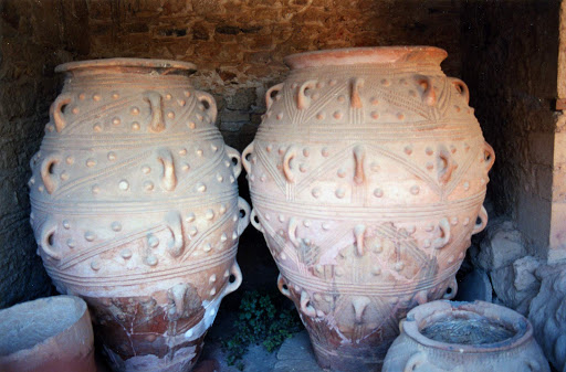 pithoi-at-Palace-of-Knossos - Six-foot-tall pithoi, or storage jars, at the Palace of Knossos. The jars, dating from the 18th century B.C., were used to store honey, wine and food. 