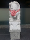 Guardian Lion with a Red Ribbon