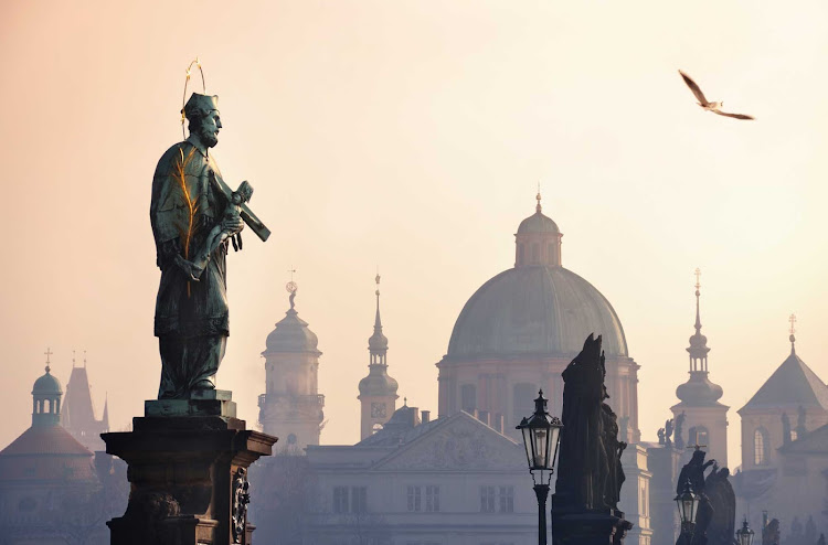 An alley of 30 baroque statues decorate the beautiful 15th-century Charles Bridge in Prague, the Czech republic. 