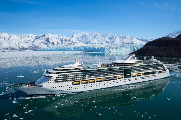 Radiance of the Seas sails through a strait hugged by glaciers in Alaska, giving passengers astonishing views of the snow-topped mountains along the coast.