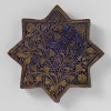 Star-shaped tile with a stylized flowering plant