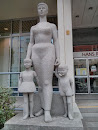 Woman with Children Statue