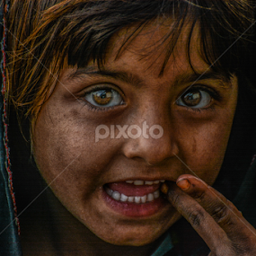Secret in their eyes by Adnan Aslam - People Street & Candids