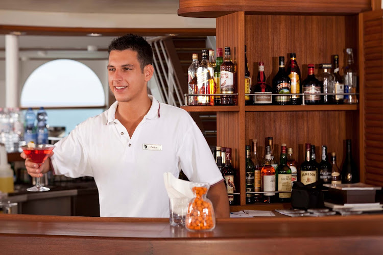 At the Sky Bar on Seabourn Sojourn, you'll find open air drinking, entertainment and attentive bartenders.