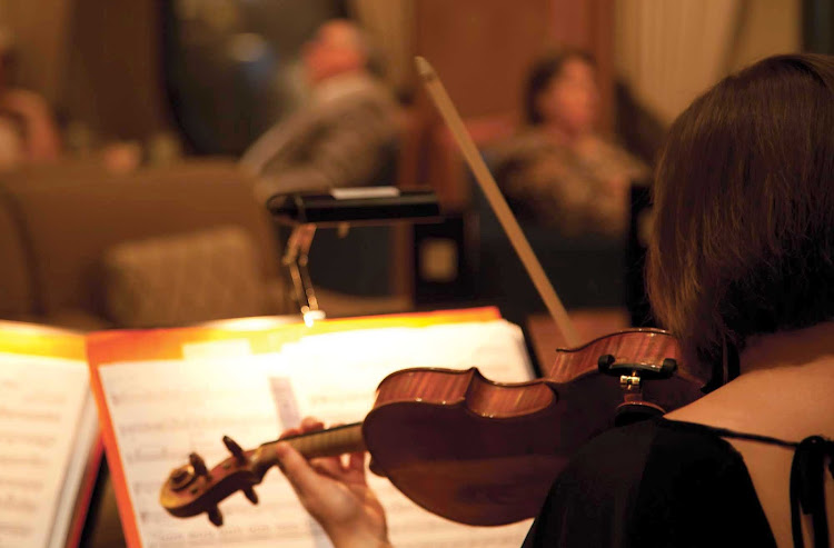You'll appreciate the beautiful strains of classical music played by a live orchestra aboard Queen Mary 2. 