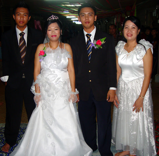 After makai the bride and groom arrived in modern dress white long bridal