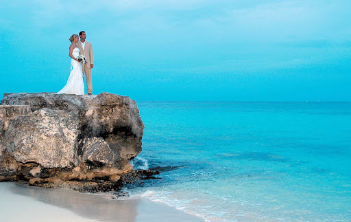 wedding-playa-azul-Cozumel - A just-married couple at Playa Azul on the island of Cozumel, Mexico.