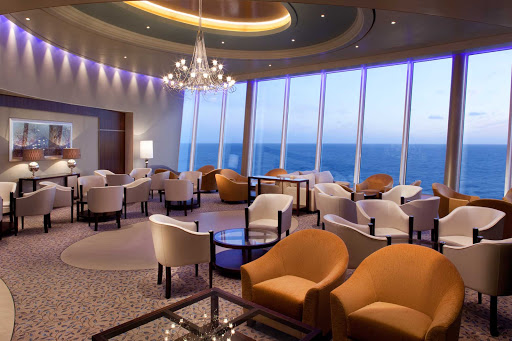 Kick back and take in the views at the Pinnacle Lounge aboard Allure of the Seas.