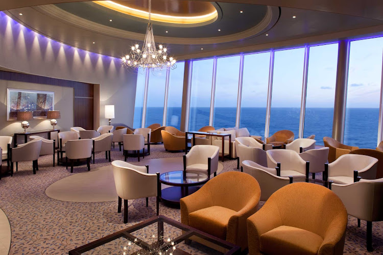 Kick back and take in the views at the Pinnacle Lounge aboard Allure of the Seas.