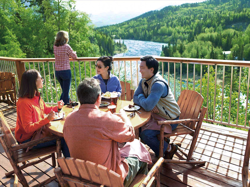 At the Kenai Princess Wilderness Lodge in Cooper Landing, Alaska, you can hang out on the deck and take in scenic views of Kenai River valley.