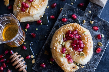 Goat Cheese Stuffed Phyllo Swirls with Pomegranate Honey + Pistachios