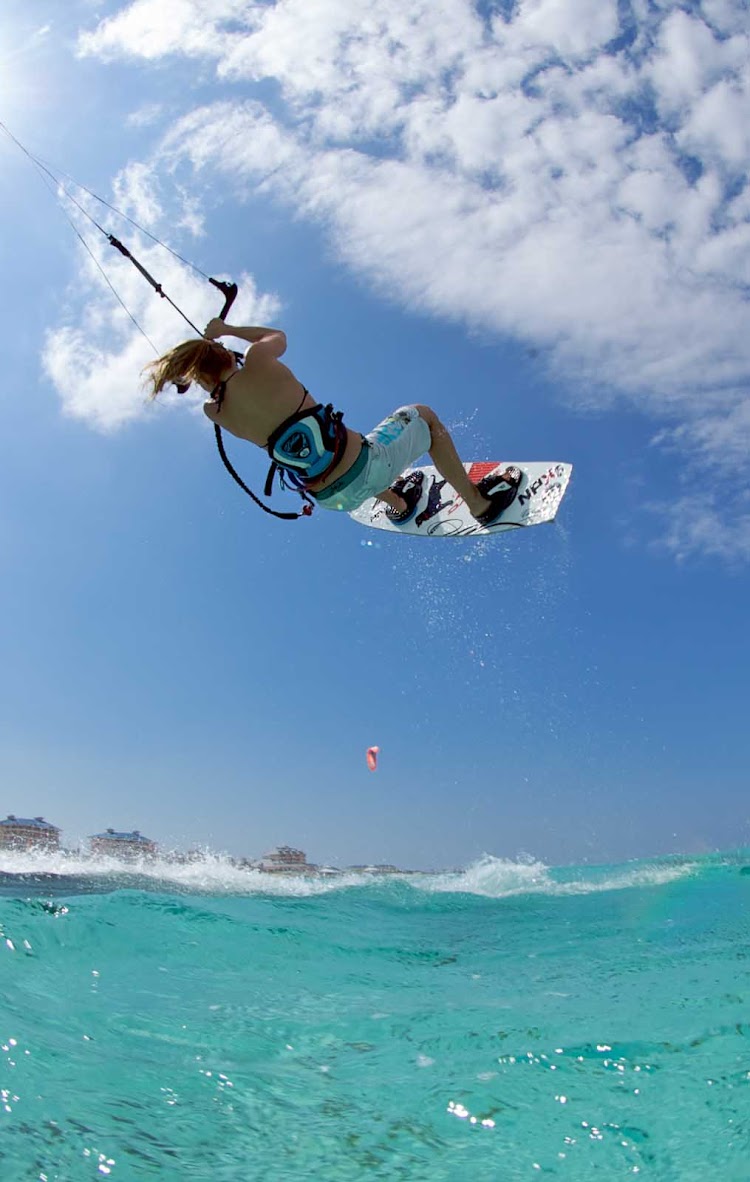 Kitesurfing — sometimes called kiteboarding or sailboarding — in the Cayman Islands.