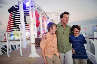 A father with his sons on the deck of Disney Dream. Disney ships have won a raft of "best for families" awards from Travel + Leisure, Conde Nast Traveler, Porthole Magazine readers and the Cruise Critic Cruisers' Choice Awards.