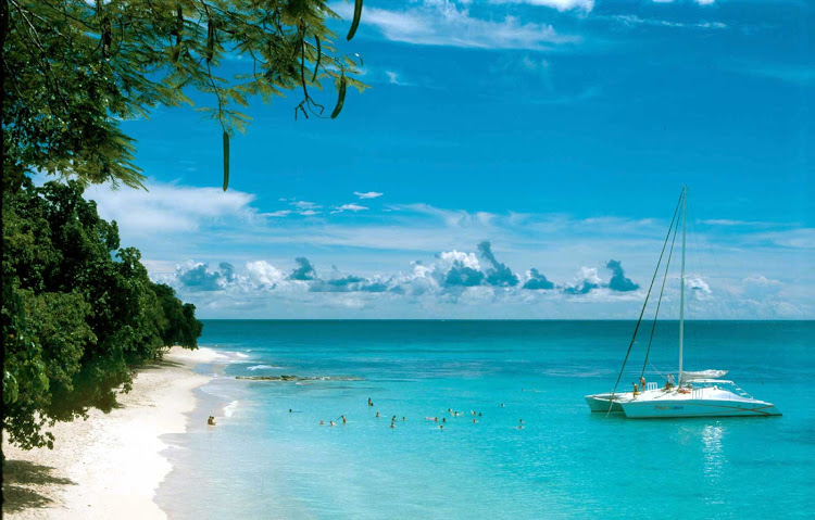A catamaran whisks passengers to a secluded beach on Barbados.