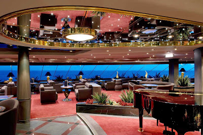 MSC Yacht Club members can unwind while appreciating the view and sophisticated ambience of MSC Divina's Top Sail Lounge.