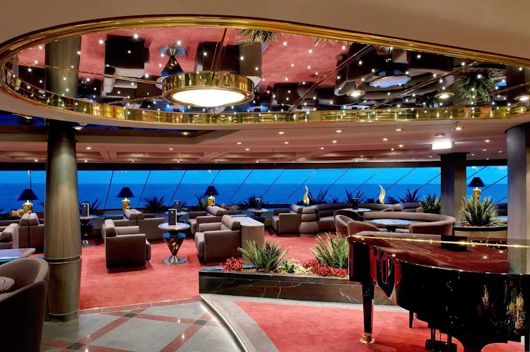 MSC Yacht Club members can unwind while appreciating the view and sophisticated ambience of MSC Divina's Top Sail Lounge.