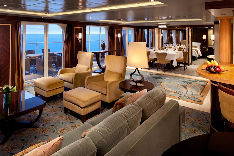 The Royal Suite on Oasis of the Seas features a grand entrance,  master bedroom with queen bed and sitting area, master bathroom, spacious living room with a sofa that converts into a double bed, a separate guest bathroom, an entertainment center and dining room.