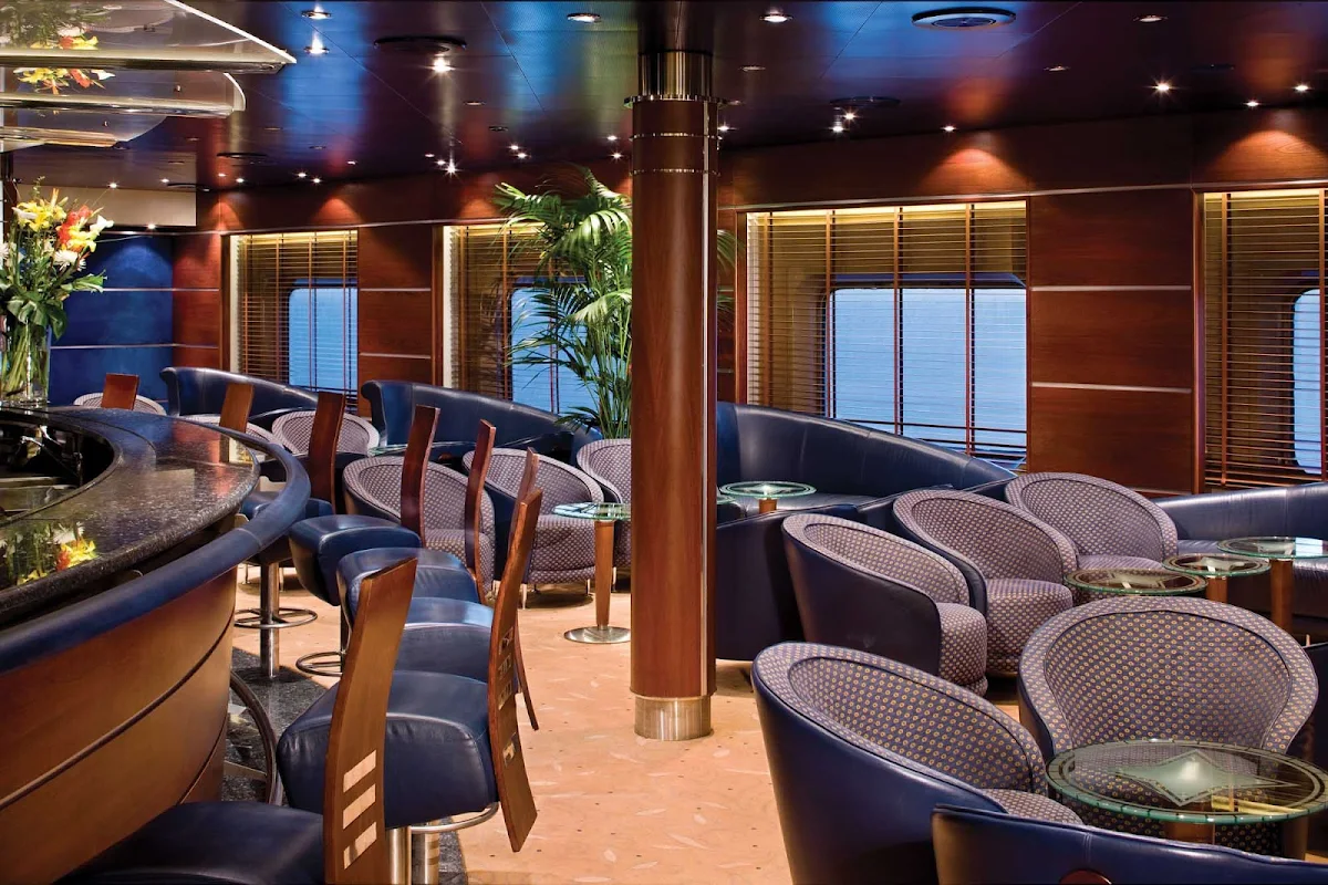 Regent-Seven-Seas-Voyager-Voyager-Lounge - The Voyager Lounge on your Regent Seven Seas cruise offers pre-dinner cocktails in the early evening and later transforms into a lively nightclub.