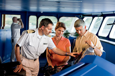Captain Mirkovic explains an instrument panel on the bridge of the Gauguin.
