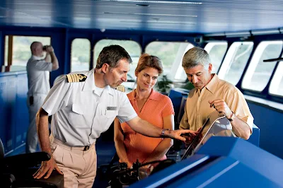 Captain Mirkovic explains an instrument panel on the bridge of the Gauguin.