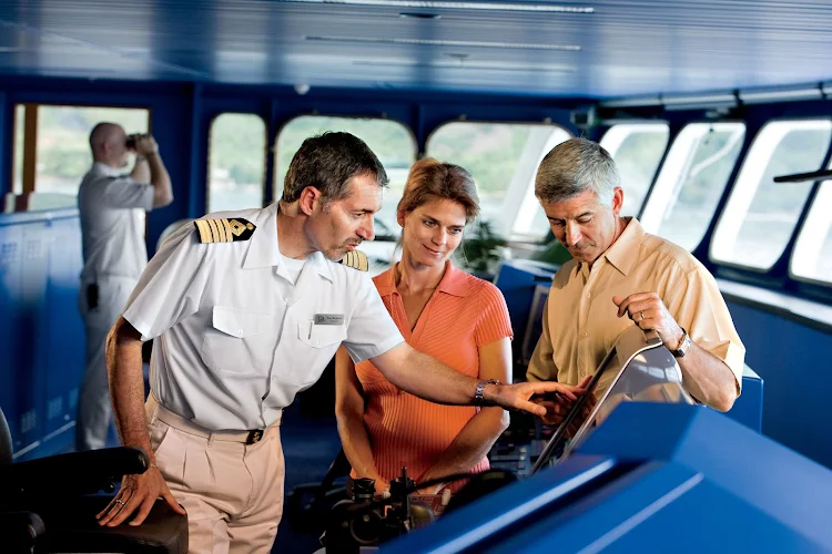Captain Mirkovic explains an instrument panel on the bridge of the Gauguin.