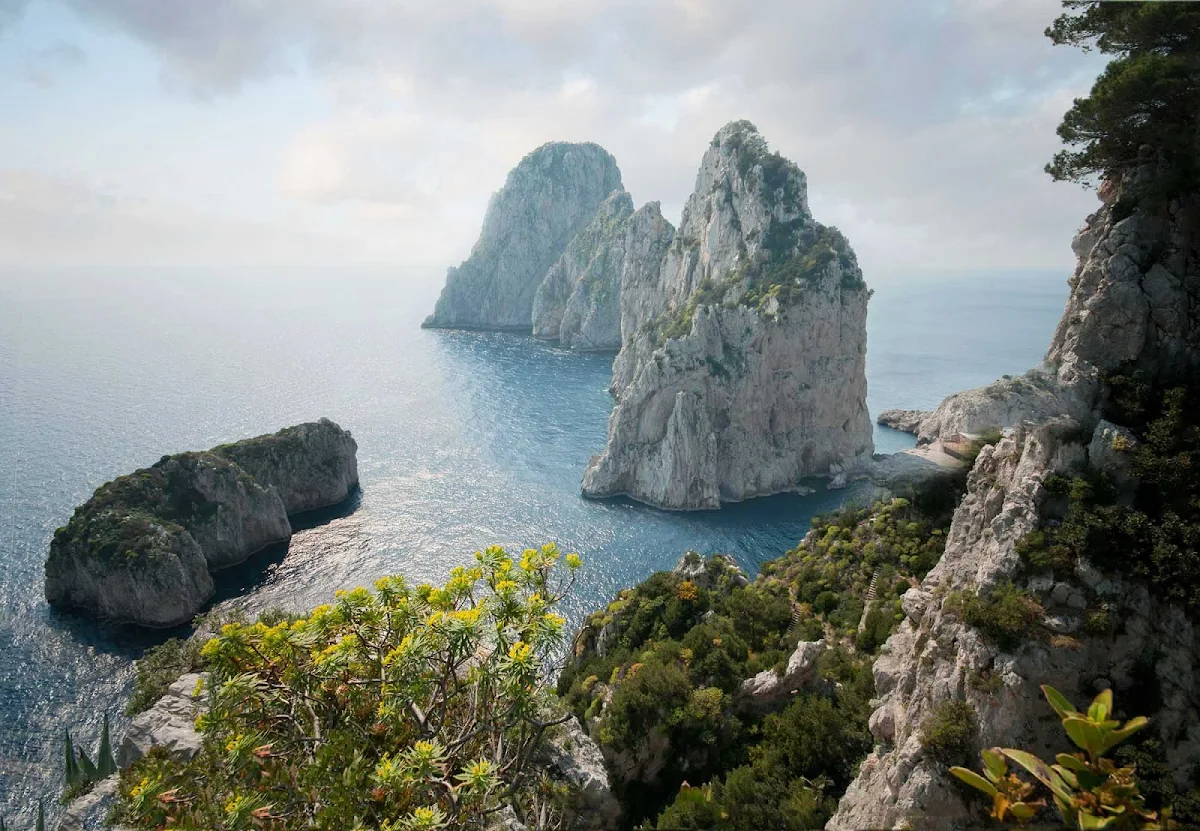 faraglioni-capri-italy - The Faraglioni of Capri, Italy, are three geological stacks that have survived earthquakes and landslides.